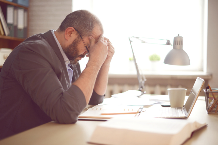 Mature Adult man working in the office.