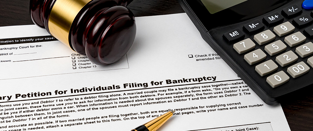 a document, a calculator, and a gavel